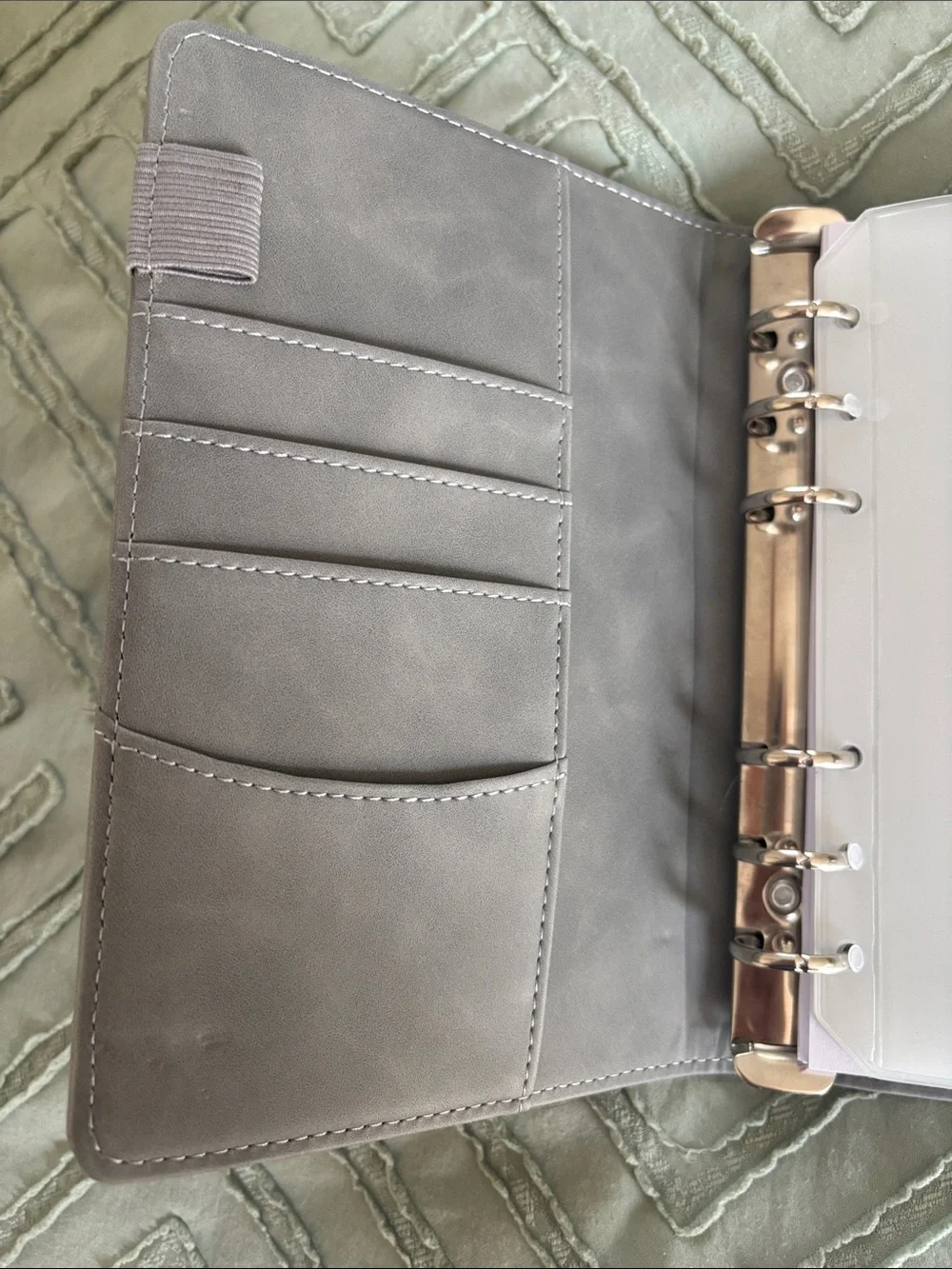 Grey budget binder with zipper pockets and budget tracker sheets